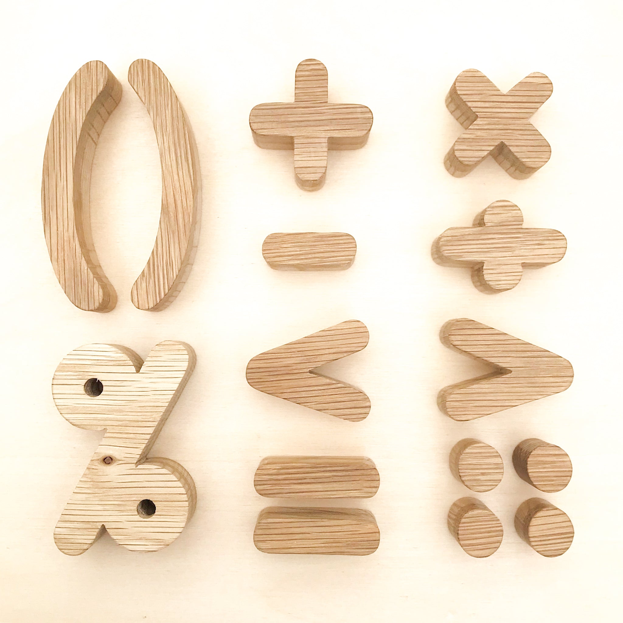 Wooden Oak Education math symbols. Included + - = % ÷ < > ( ) . . . on a wooden background